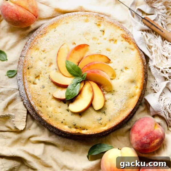 Homemade Peach Muffins with Fresh Summer Fruit 6 Single layer cake topped with yellow peaches and basil on a wood board.