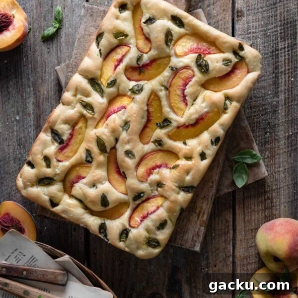 Homemade Peach Muffins with Fresh Summer Fruit 7 Peach focaccia bread loaf on cutting board.