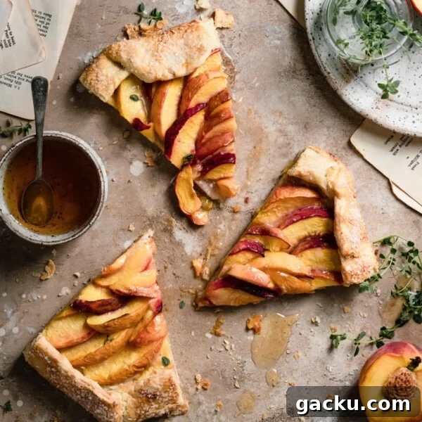 Homemade Peach Muffins with Fresh Summer Fruit 8 Three slices of a peach galette on a table top next to a bowl of honey.