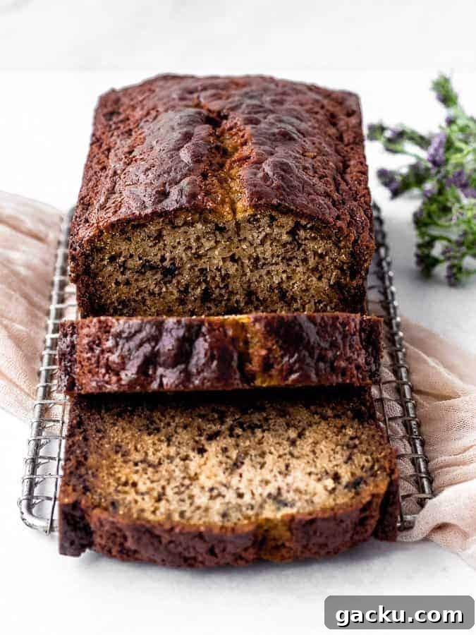 Sour cream banana bread sliced to show the moist inside.