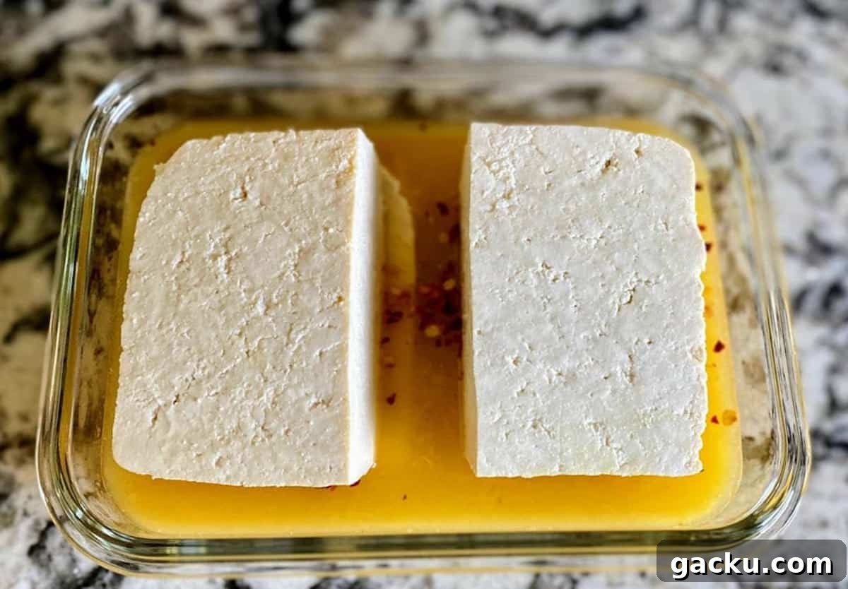 Tofu slabs marinating in the citrus marinade. 