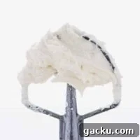 Cream Cheese Frosting Recipe: Smooth, Tangy, and Perfect for Cakes 8 Homemade Cream Cheese Frosting recipe on a metal beater
