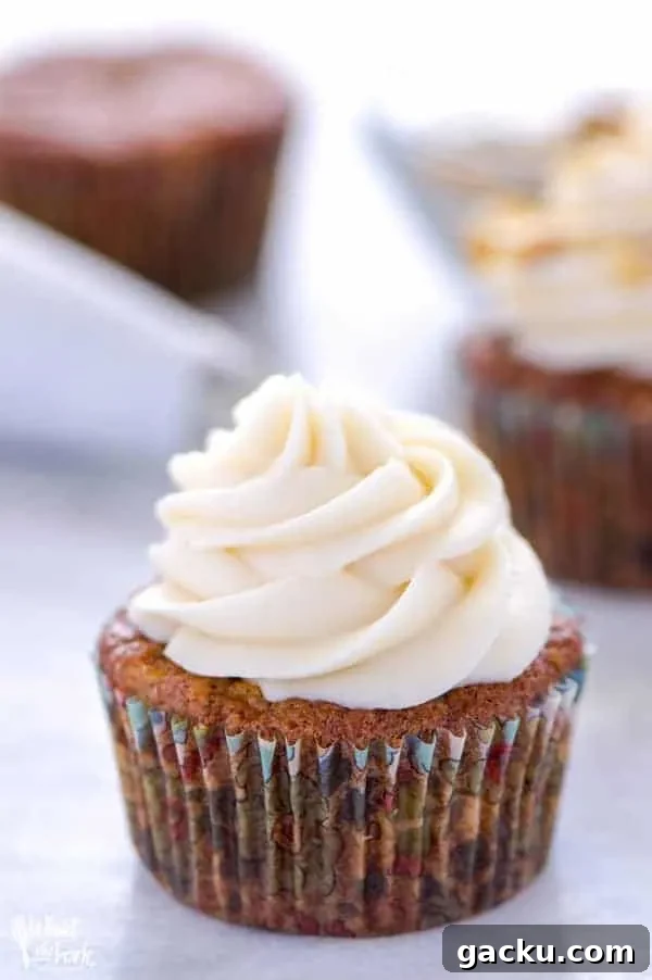 Cream Cheese Frosting Recipe: Smooth, Tangy, and Perfect for Cakes 3 gluten free carrot cake cupcake with cream cheese frosting on platter