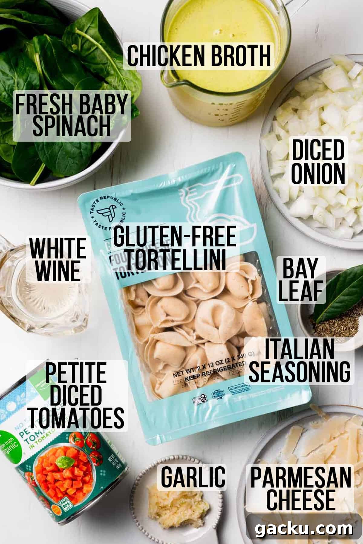 Ingredients needed for gluten free spinach tortellini soup measured in bowls on white surface.