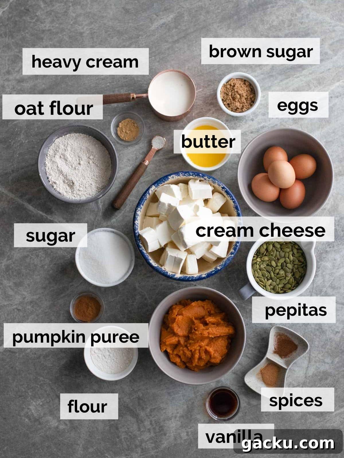 Ingredients for pumpkin cheesecake on a table.