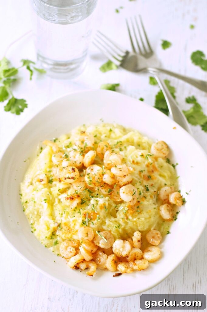 Slow Cooker Spaghetti Squash with shrimp in white bowl with two forks and glass