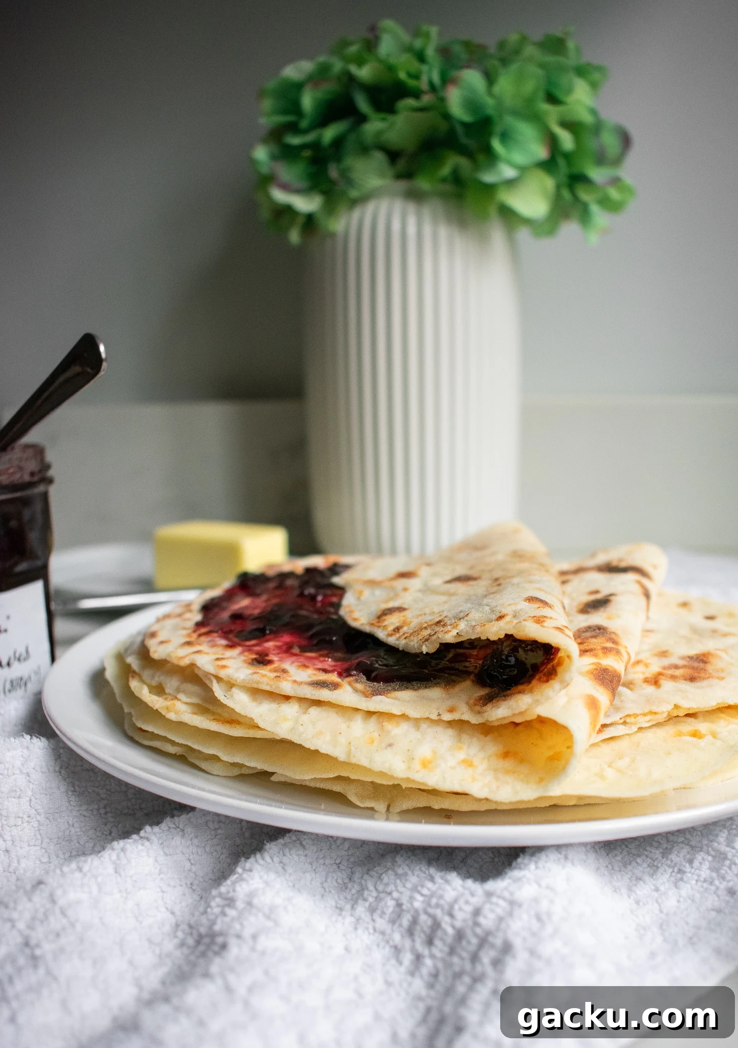 How to Make Traditional Norwegian Lefse: Potato Flatbread Recipe 2 Potato pancakes on a plate with jam
