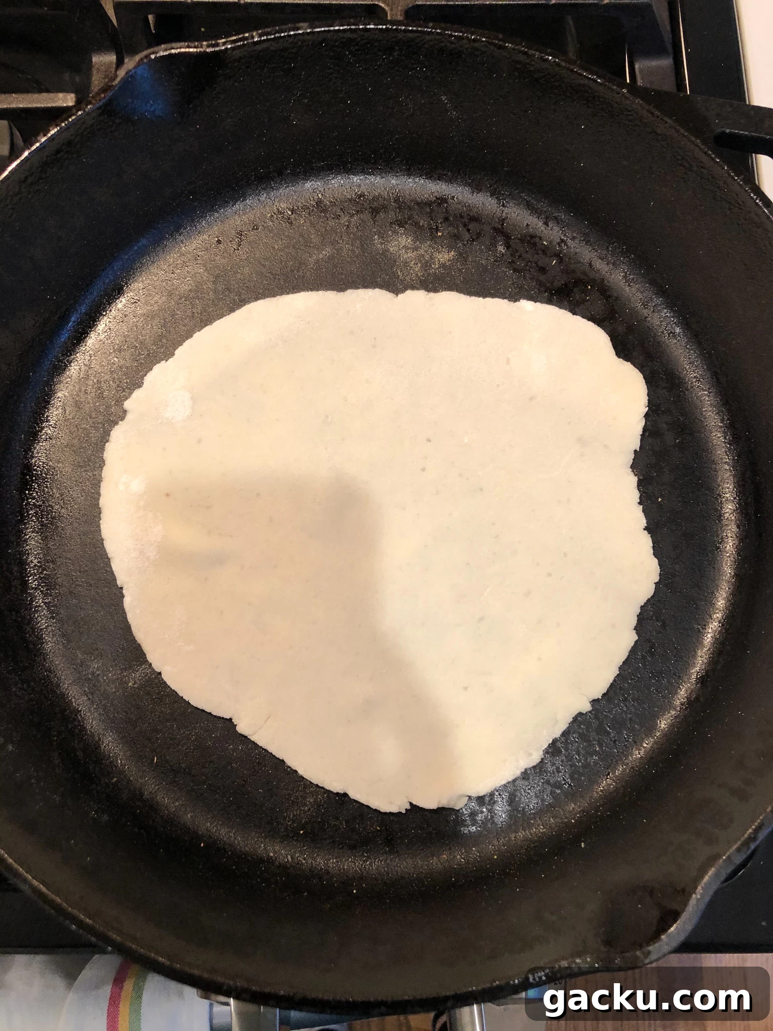 How to Make Traditional Norwegian Lefse: Potato Flatbread Recipe 13 Dough cooking on the stove