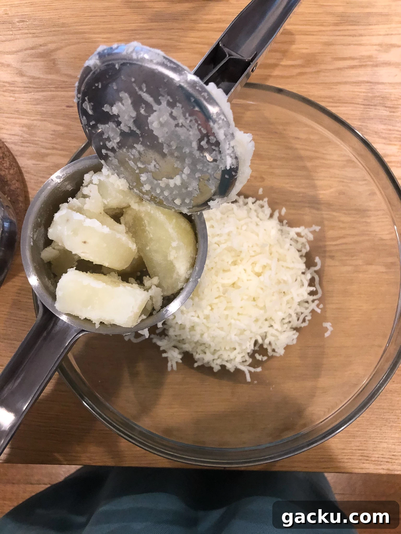 How to Make Traditional Norwegian Lefse: Potato Flatbread Recipe 6 Potatoes being passed through a potato ricer