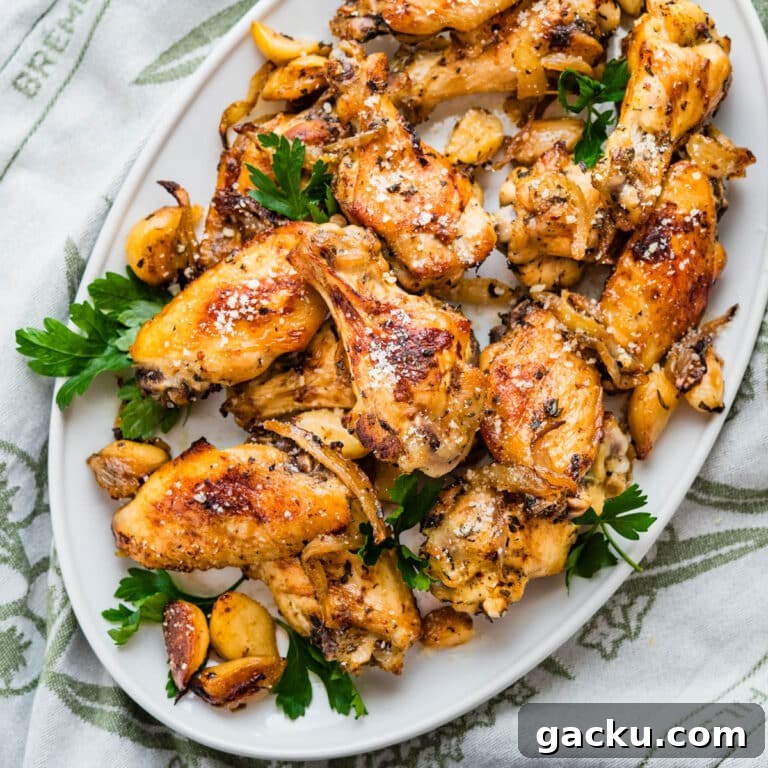 Garlic Parmesan Wings recipe on a white platter.