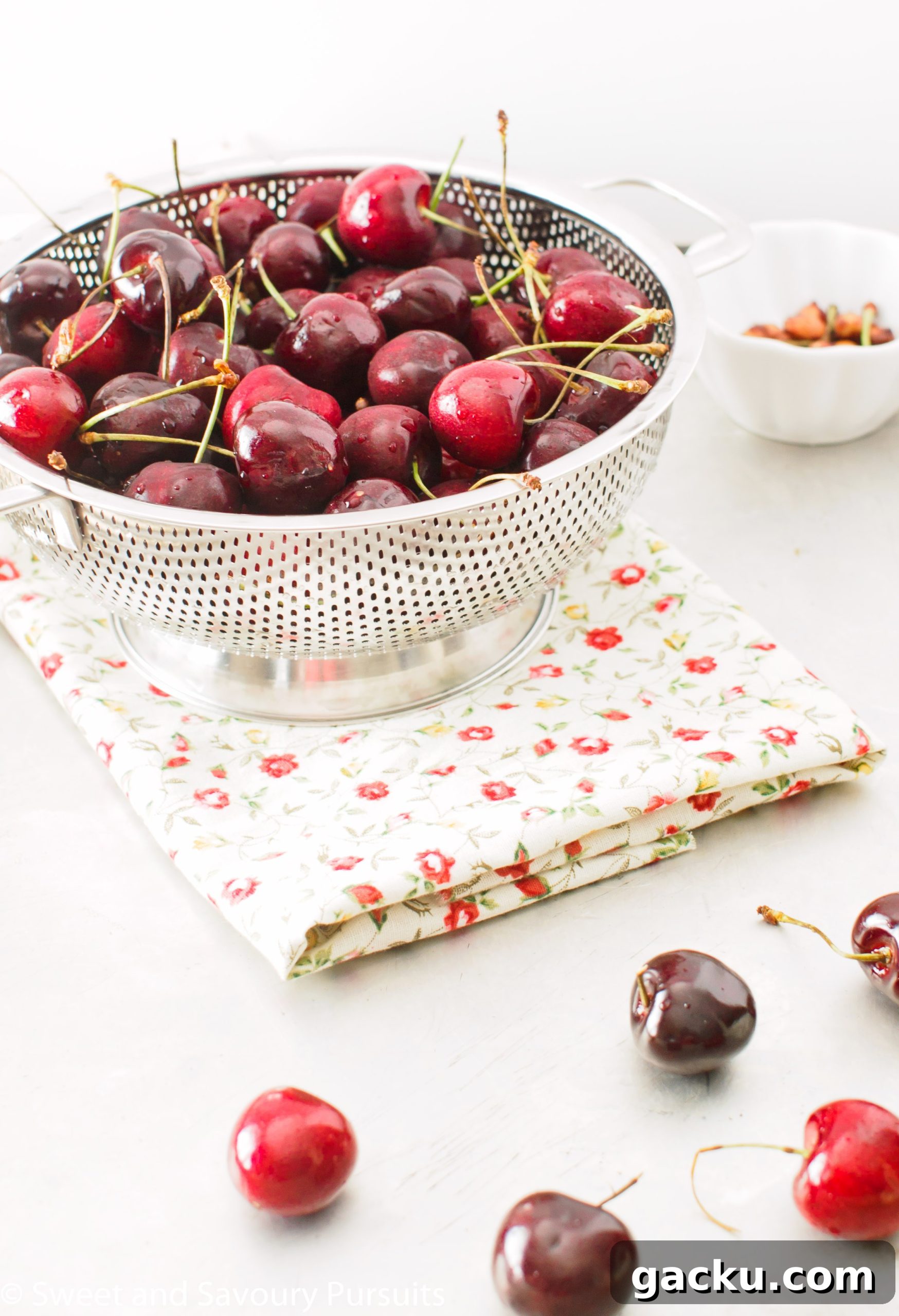 Colander full of freshly washed cherries.