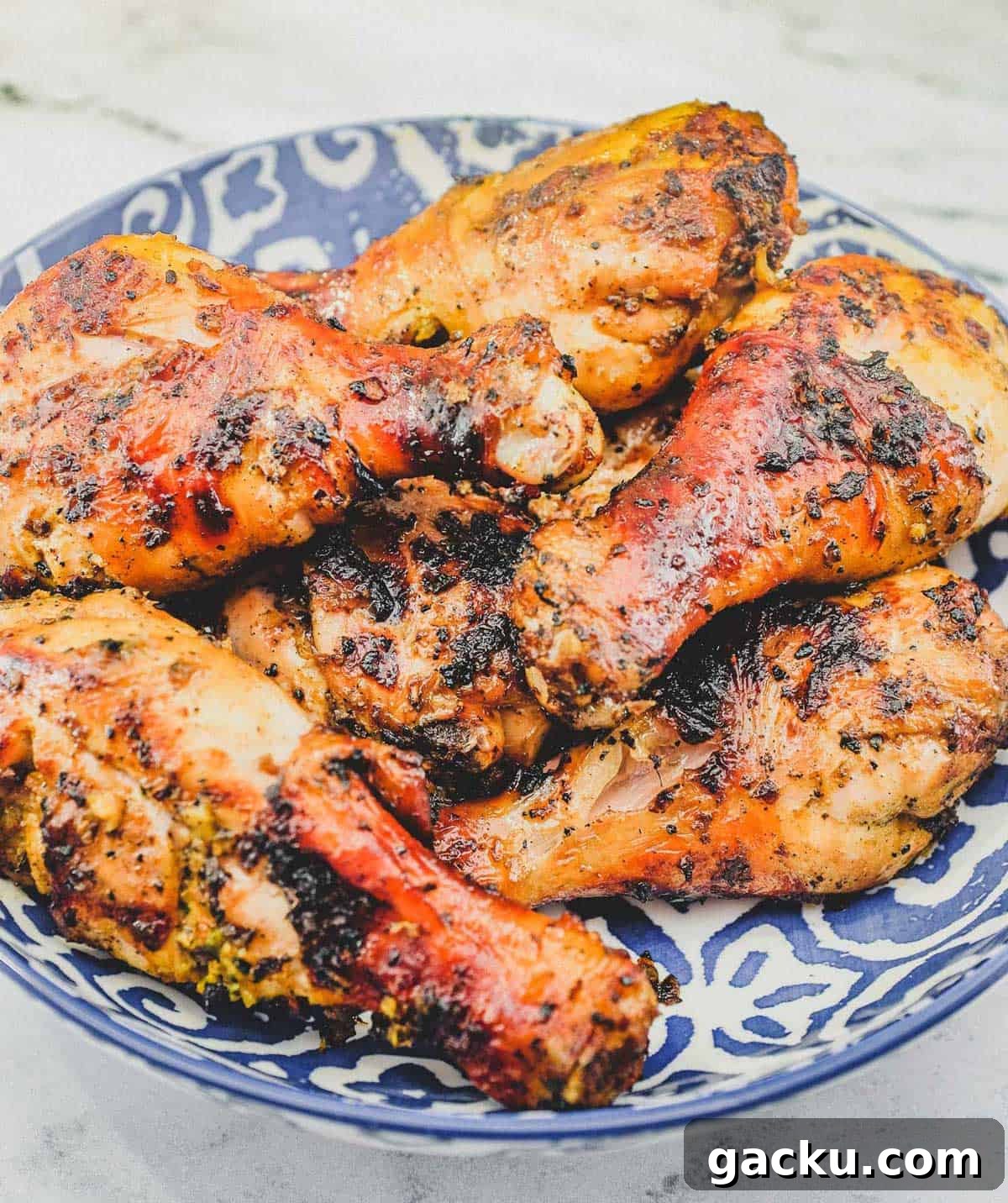 A bowl of cha-style chicken grilled over hot coals. Thai-Style Grilled Chicken (Gai Yang)