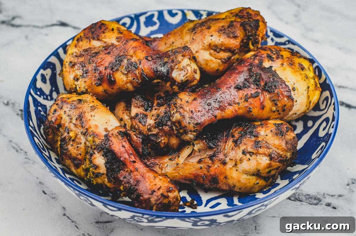 A bowl of cha-style chicken grilled over hot coals. Thai-Style Grilled Chicken (Gai Yang)