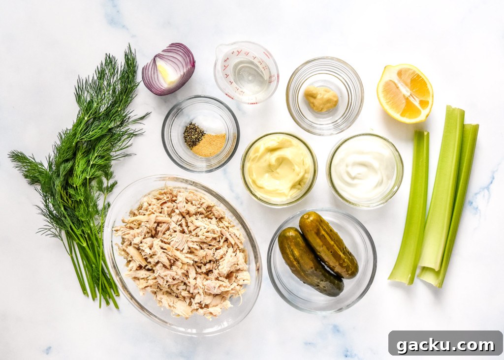 Dill Pickle Chicken Salad Recipe with Crunchy Celery & Herbs 3 ingredients on a counter before preparing the dill pickle chicken salad.