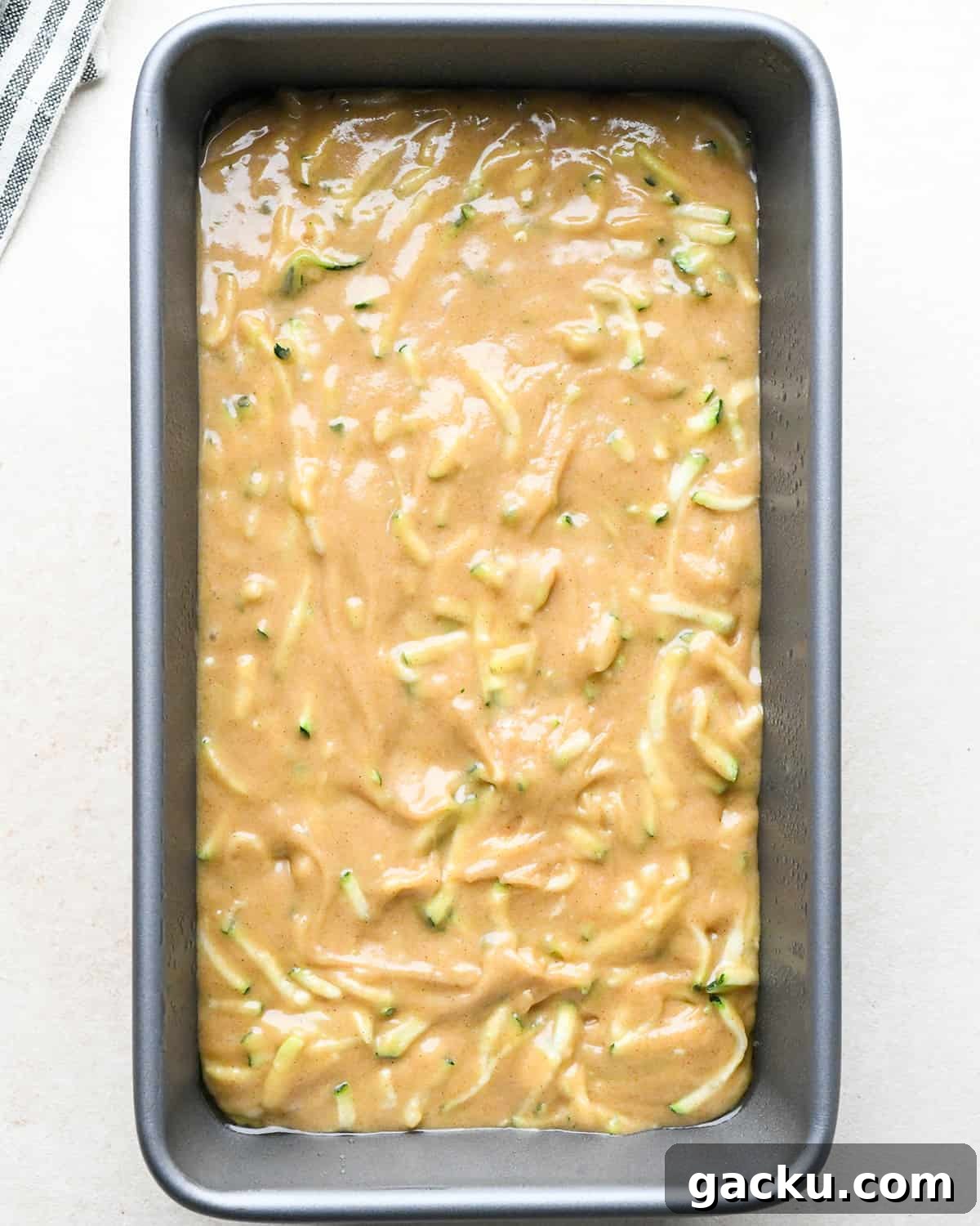 Moist Zucchini Bread Recipe That Everyone Will Love 9 How to Make Zucchini Bread - batter in a loaf pan before baking