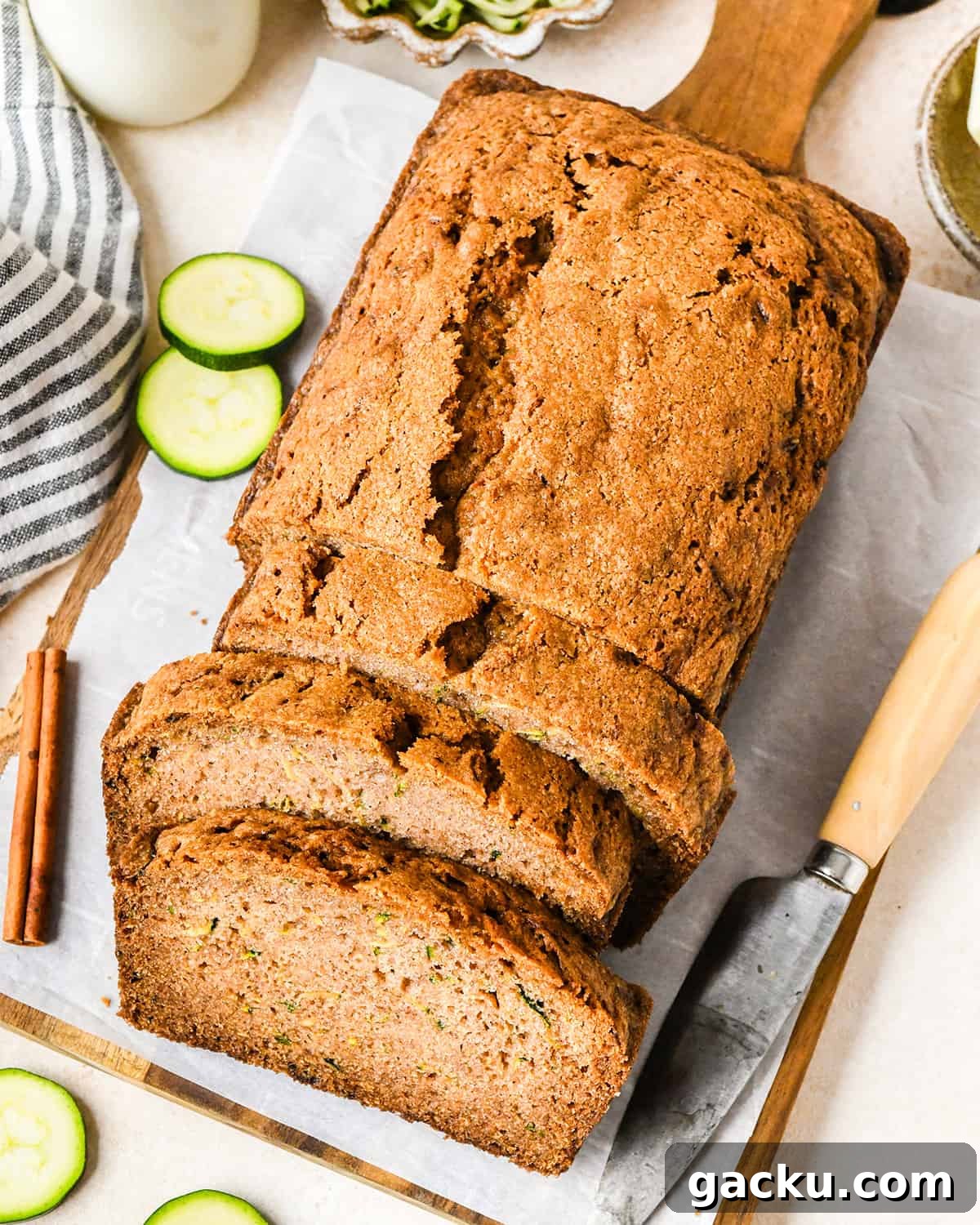 Moist Zucchini Bread Recipe That Everyone Will Love 12 a loaf of Zucchini Bread with 3 slices cut out of it