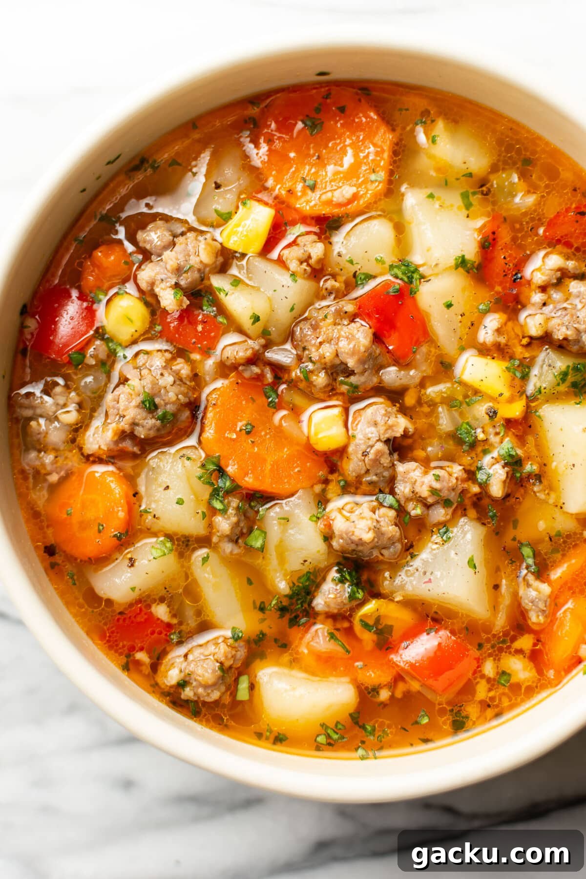 a bowl of sausage and vegetable soup