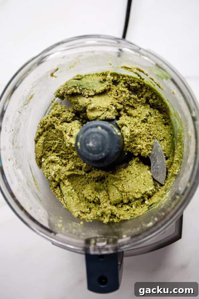 Energizing Matcha Energy Bites for Sustained Focus 4 matcha energy ball dough in a food processor