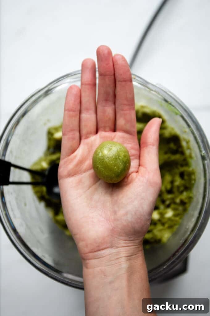 Energizing Matcha Energy Bites for Sustained Focus 6 a matcha energy ball in a hand