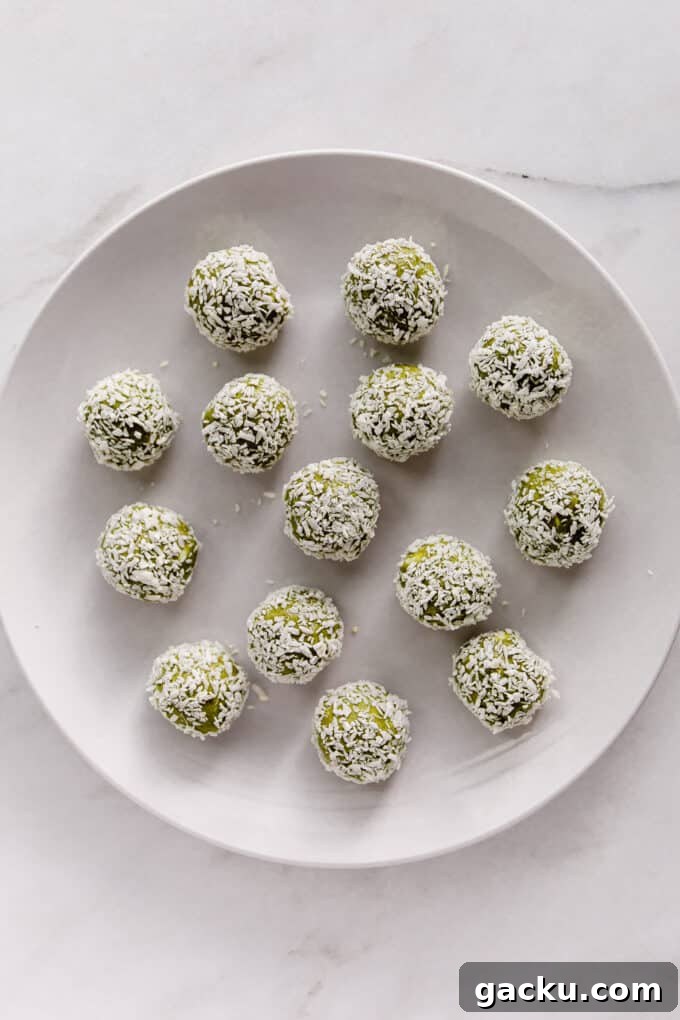 Energizing Matcha Energy Bites for Sustained Focus 8 matcha energy balls on a white plate