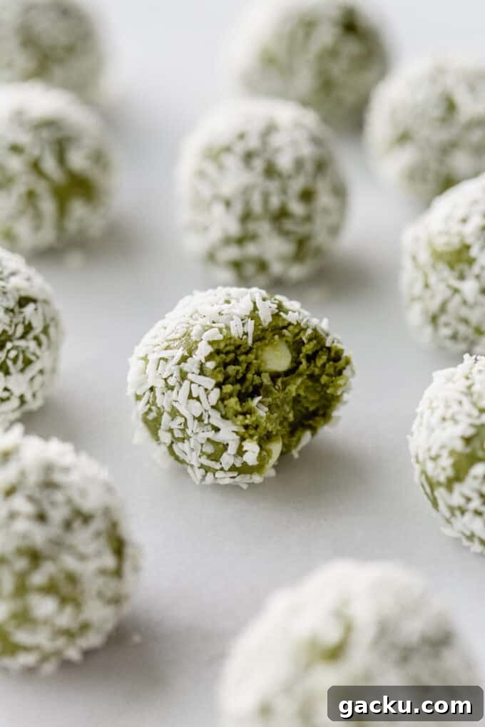 Energizing Matcha Energy Bites for Sustained Focus 9 matcha bites on a marble counter