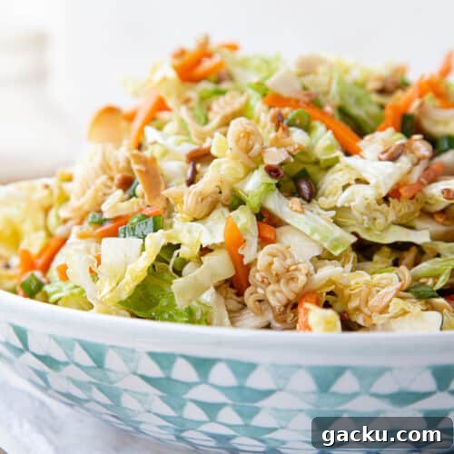 asian cabbage salad in a blue and white decorative bowl.