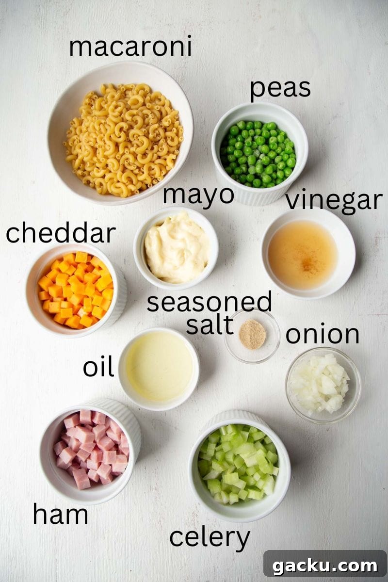 Cheesy Ham Macaroni Salad with Sharp Cheddar 4 macaroni, peas, ham, cheddar, celery, mayo, and other ingredients.