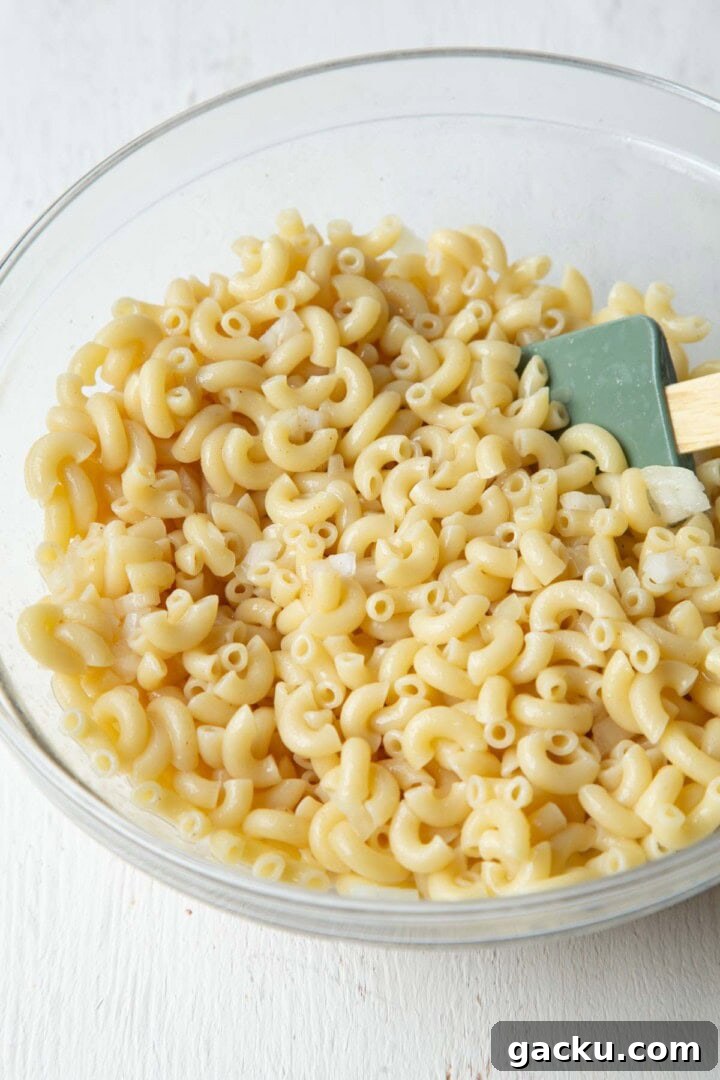 Cheesy Ham Macaroni Salad with Sharp Cheddar 5 cooked macaroni in a bowl.