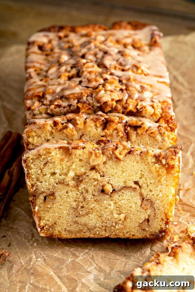Cinnamon Apple Quick Bread Recipe for Moist, Spiced Loaf 3 Quick bread with a brown sugar and apple streusel running through the middle of the bread.