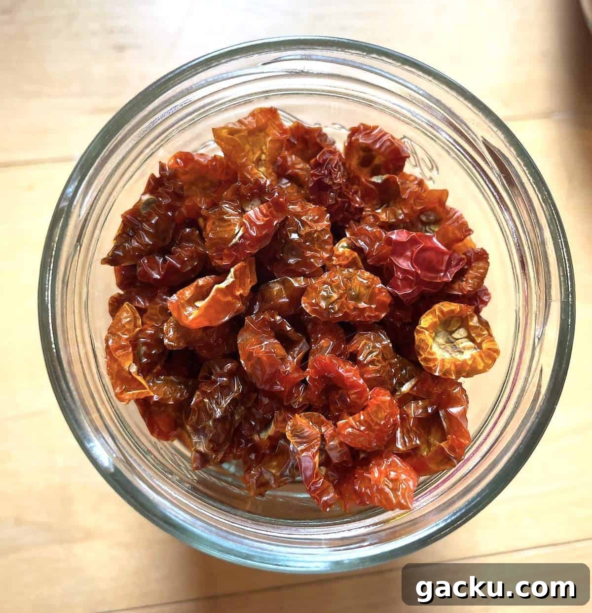 Dehydrating Cherry Tomatoes: Step-by-Step Guide for Perfect Results 2 A jar filled with dehydrated cherry tomatoes.