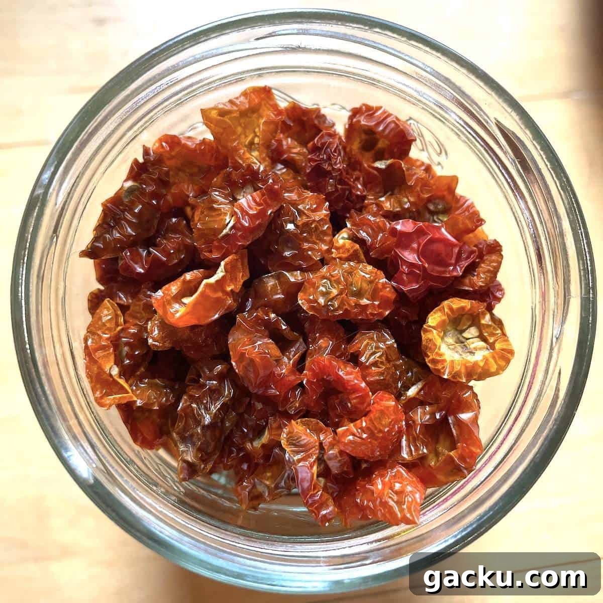 Dehydrating Cherry Tomatoes: Step-by-Step Guide for Perfect Results 9 A jar filled with dehydrated cherry tomatoes.