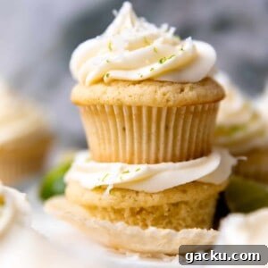 Coconut Lime Cupcakes with Creamy Coconut Frosting 10 Stacked coconut lime cupcakes topped with coconut cream cheese frosting.