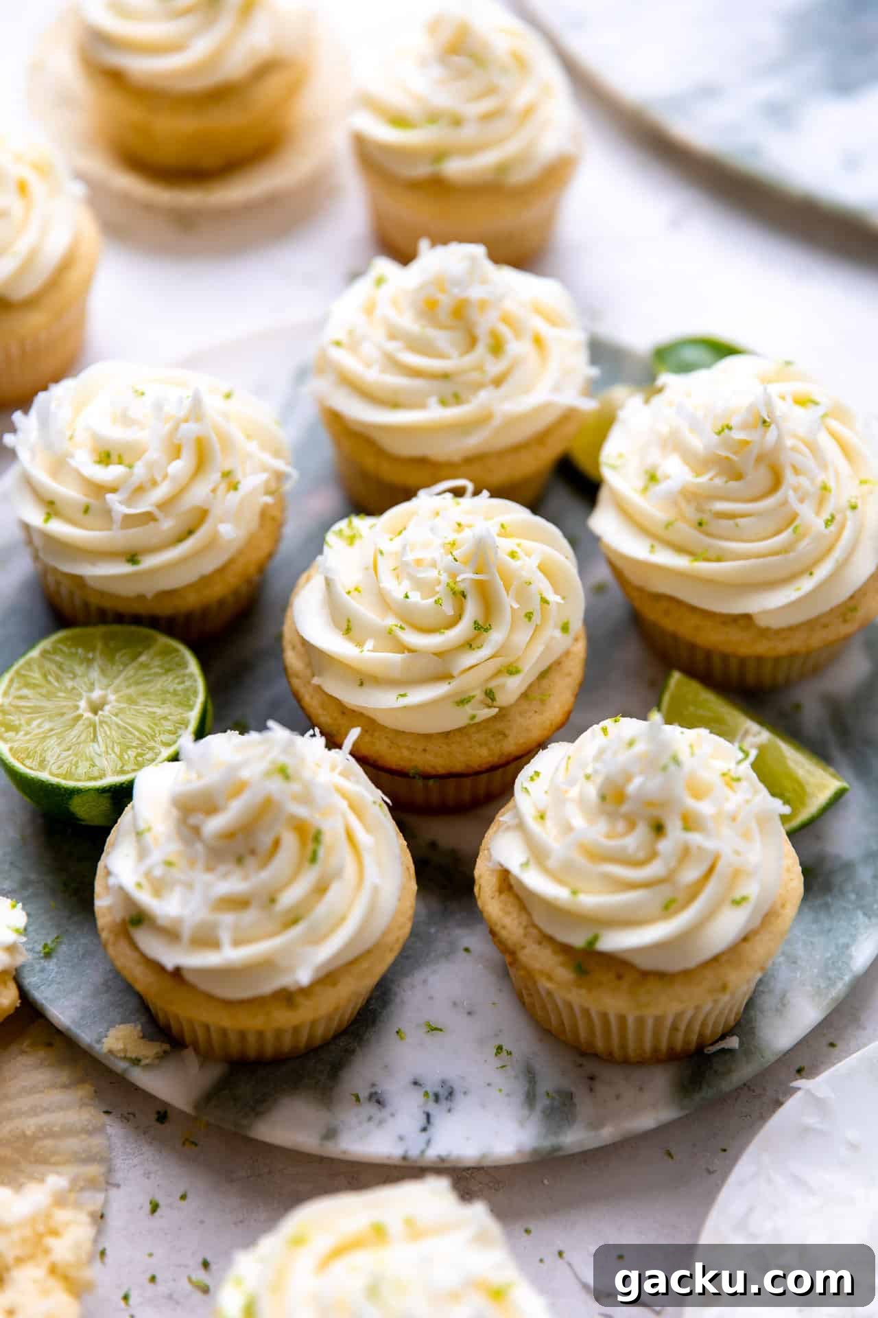 Coconut Lime Cupcakes with Creamy Coconut Frosting 9 Tray filled with coconut lime cupcakes.