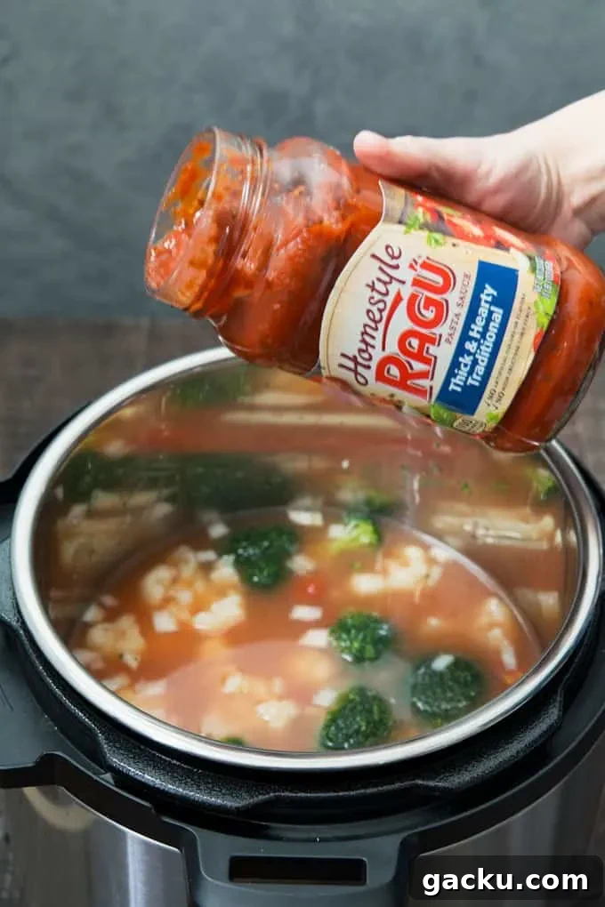 ragu sauce being poured into instant pot