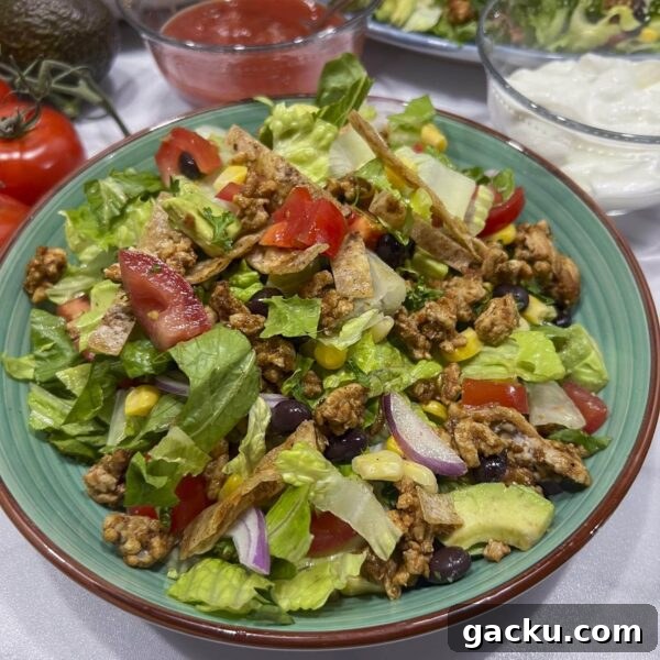 Weeknight Taco Salad: 20-Minute Recipe for Busy Evenings 2 tossed taco salad in bowl ready for toppings