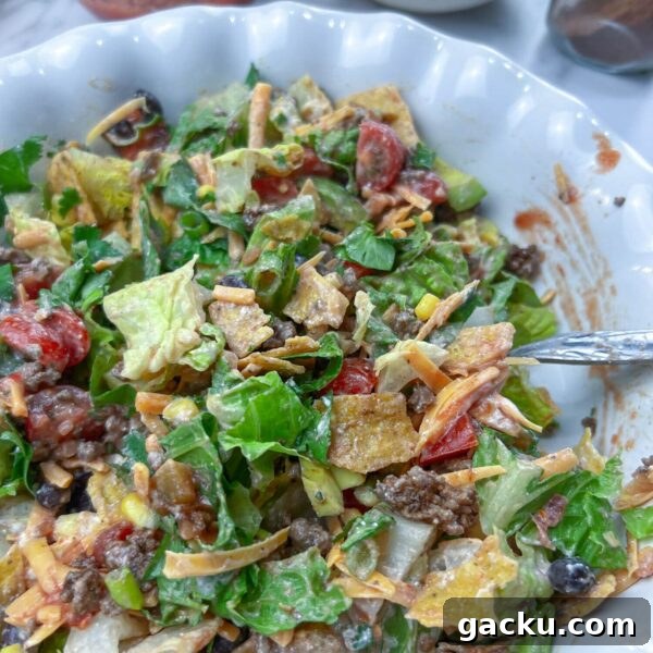 Weeknight Taco Salad: 20-Minute Recipe for Busy Evenings 6 taco salad all mixed up in a pie plate