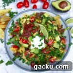 Weeknight Taco Salad: 20-Minute Recipe for Busy Evenings 8 taco salad in bowl with avocado and tomatoes on side