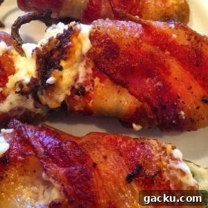Cheesy Stuffed Jalapeños: Crispy Bacon-Wrapped Poppers Recipe 7 Stuffed fresh jalapeno peppers with cream cheese wrapped in bacon.