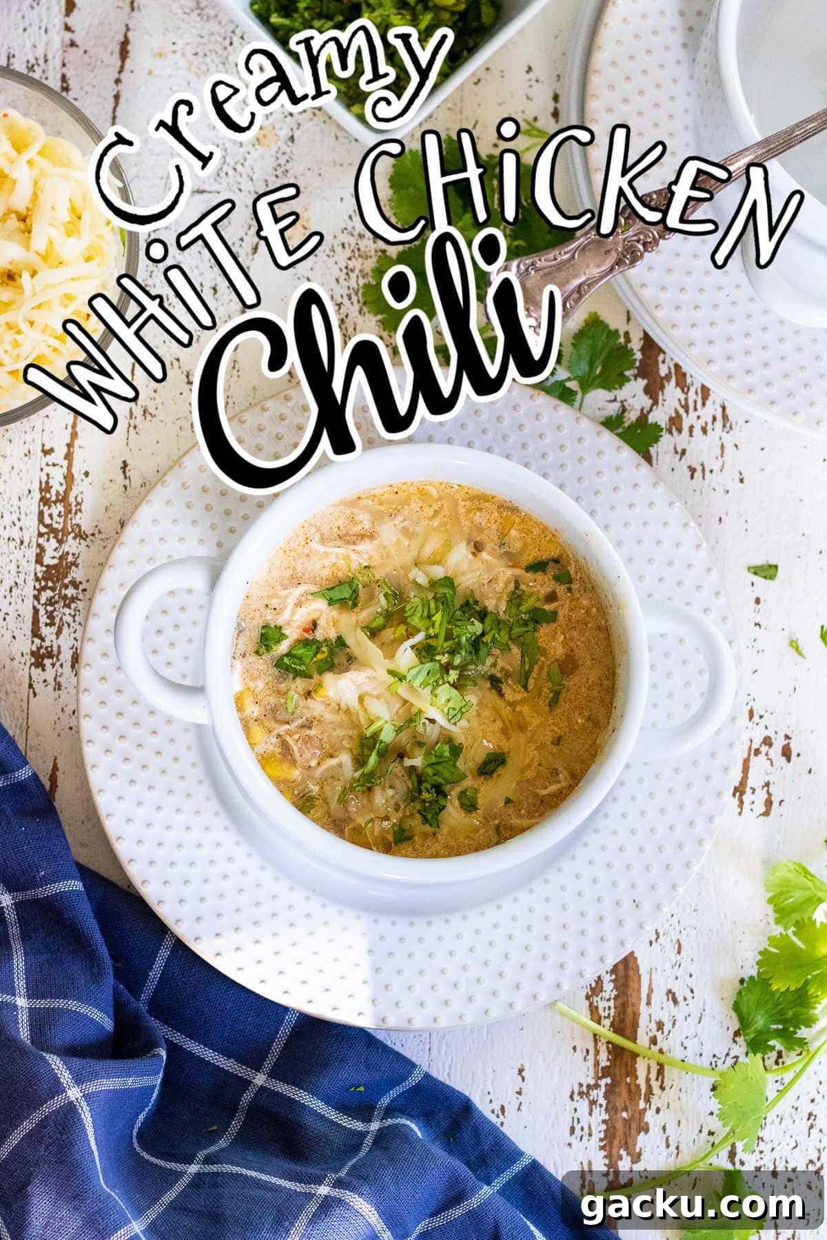 Bowl of chicken chili on a table. Title text overlay.
