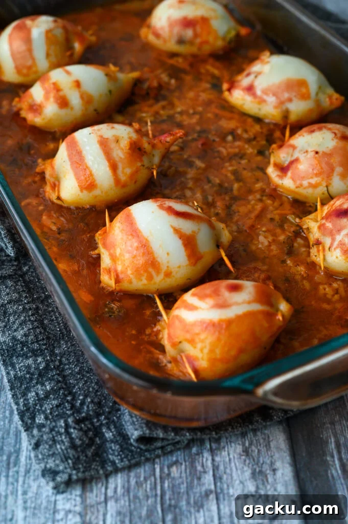 Greek-Style Stuffed Calamari Recipe with Lemon and Herbs 8 Baked squid stuffed with rice and herbs and baked in a tomato sauce.