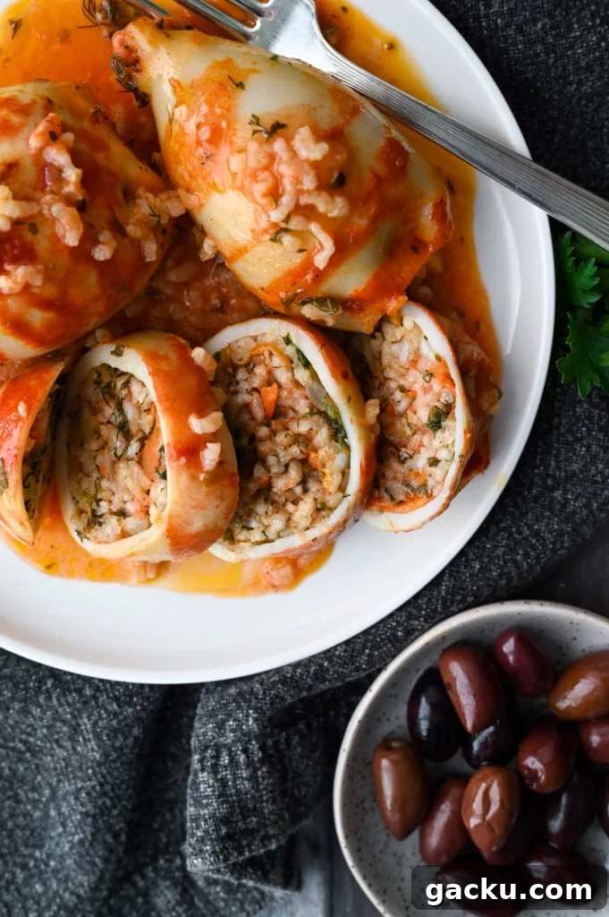 Greek-Style Stuffed Calamari Recipe with Lemon and Herbs 9 Baked squid stuffed with rice and herbs and baked in a tomato sauce.