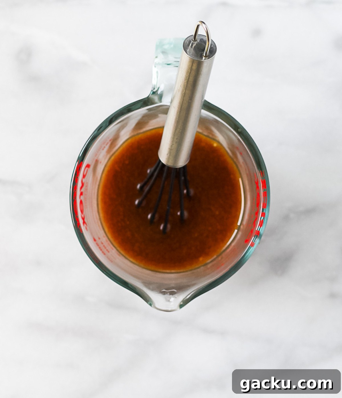 Sesame Ginger Salad Dressing Recipe for Crisp Greens 4 Sesame ginger salad dressing in a measuring cup