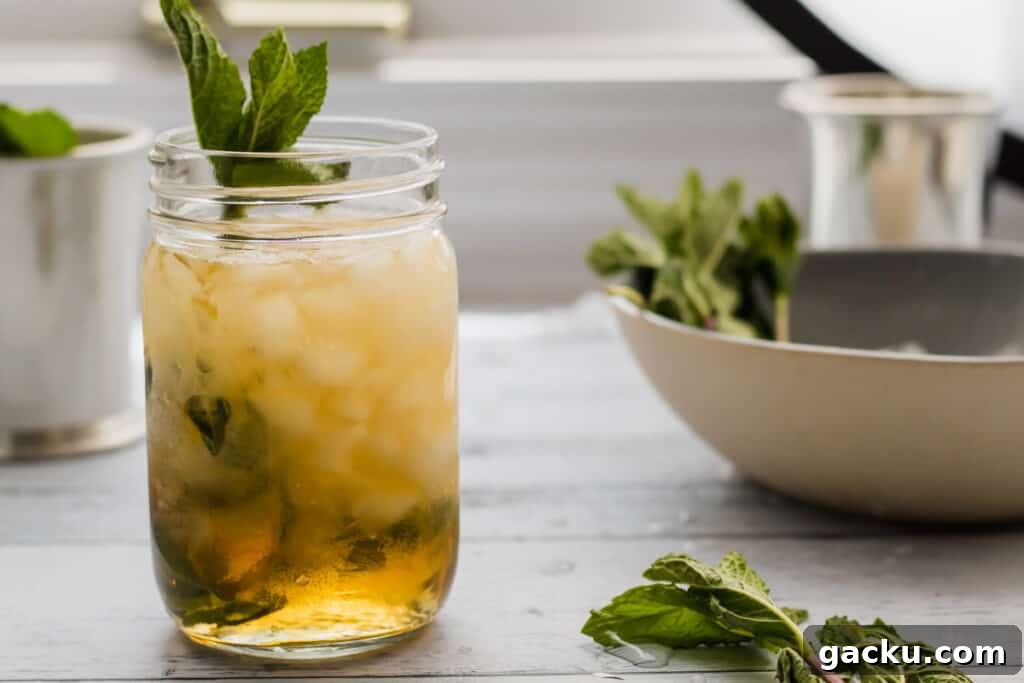 Classic Mint Julep Recipe: How to Make the Southern Cocktail 6 mason jar mint julep with mint garnish