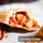 A mini apple pie with homemade apple filling.