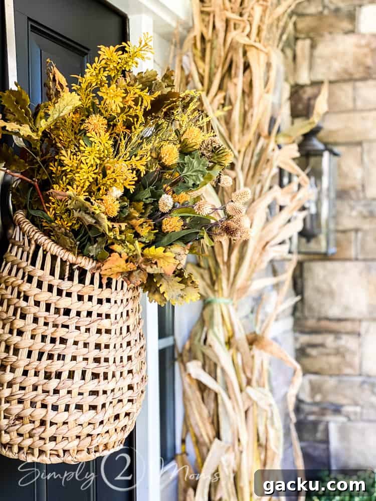 15 Fall DIY Home Decor Crafts to Transform Your Space 2 side view of hanging door basket filled with fall stems on front door
