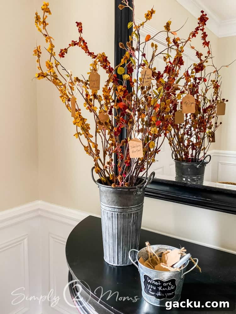 15 Fall DIY Home Decor Crafts to Transform Your Space 13 thankful tree with fall stems in foyer