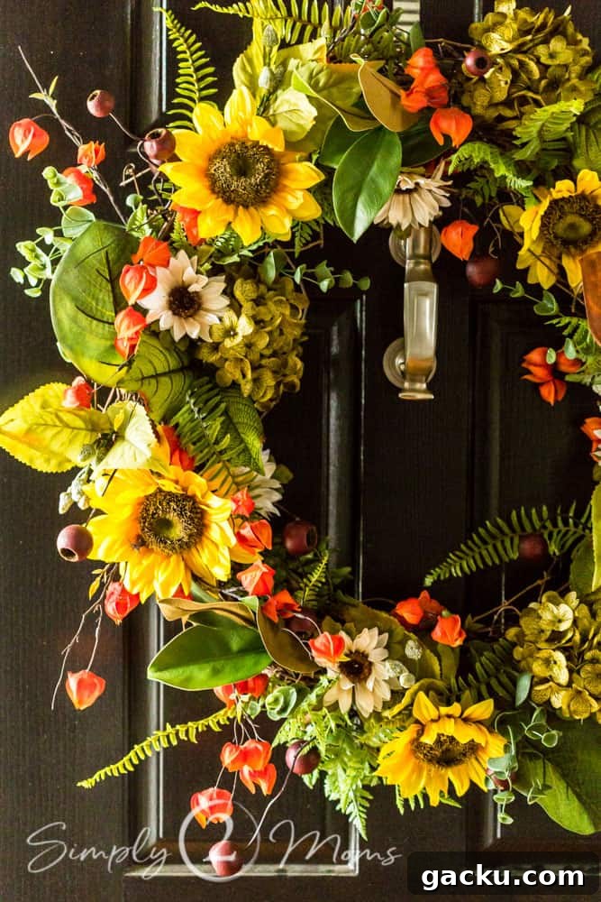 15 Fall DIY Home Decor Crafts to Transform Your Space 15 colorful fall floral wreath hanging on a door