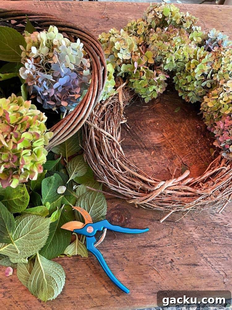 15 Fall DIY Home Decor Crafts to Transform Your Space 4 grapevine wreath with fresh cut hydrangea blooms on table