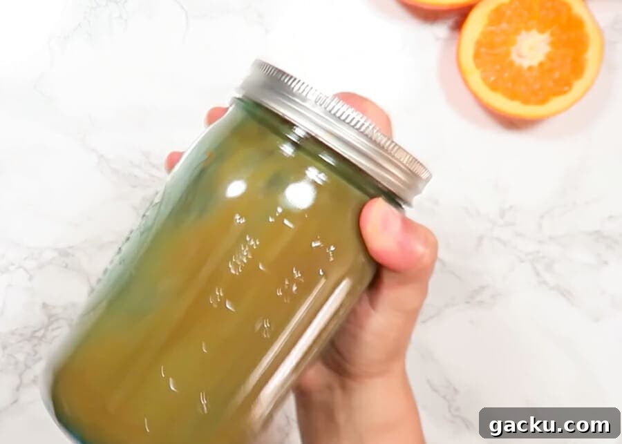30-Minute Baked Orange Chicken (Low-Calorie, Crispy) 7 Shaking the orange sauce in a mason jar