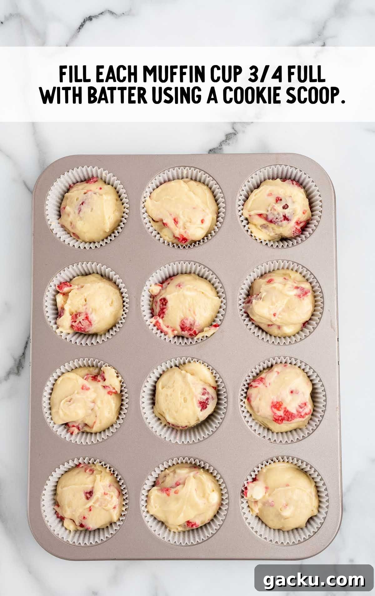 White Chocolate Raspberry Muffins with Fresh Raspberries 6 muffin batter scooped into the muffin pan